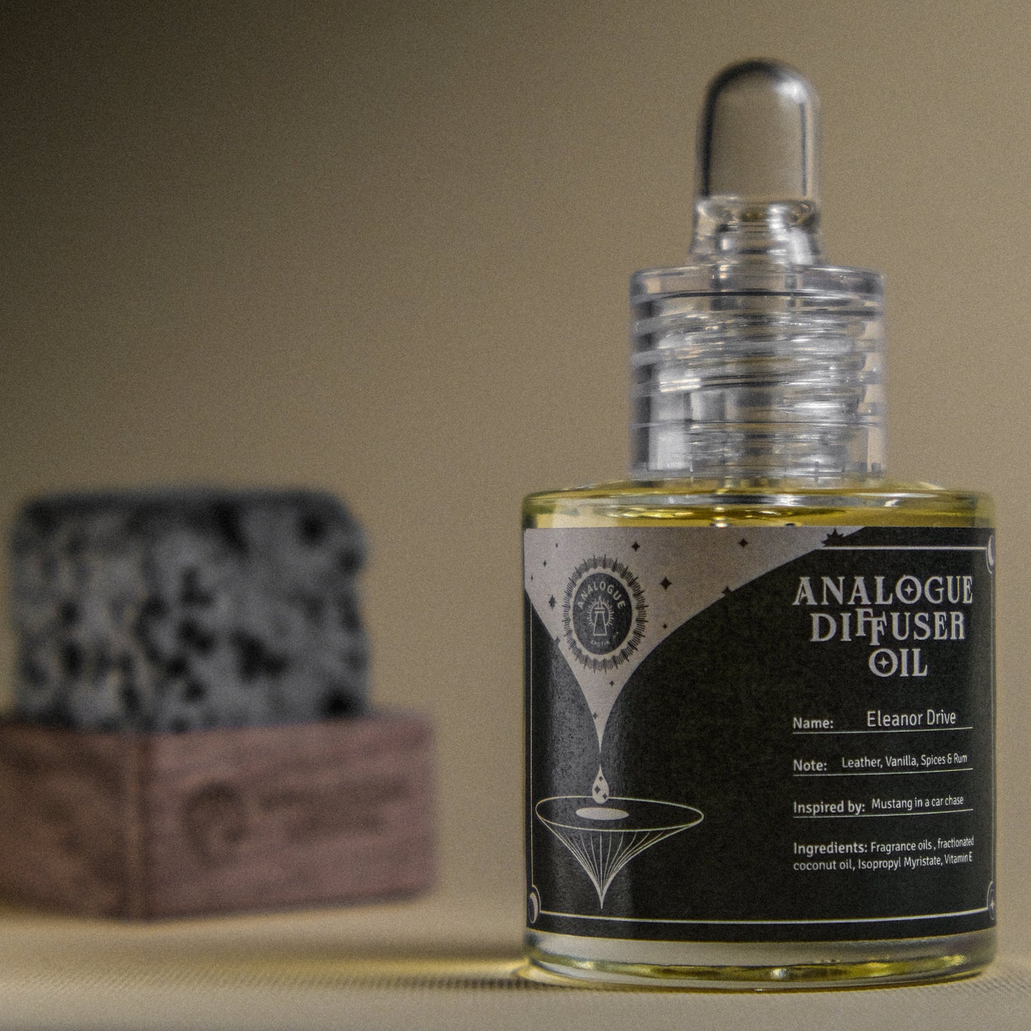 Bottle of Analogue Diffuser Oil with a blurred background