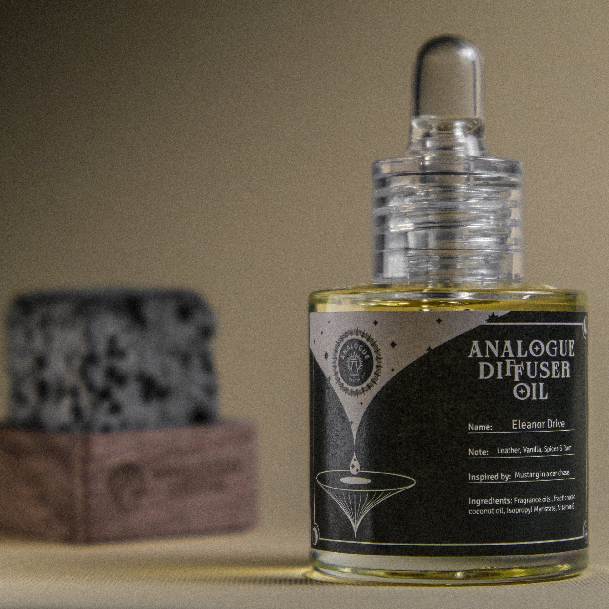 Bottle of Analogue Diffuser Oil with a blurred background
