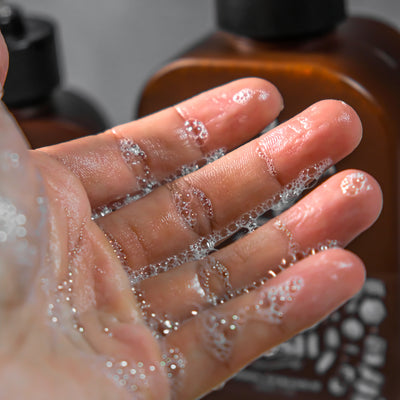 Hands resting after application, letting the scent settle