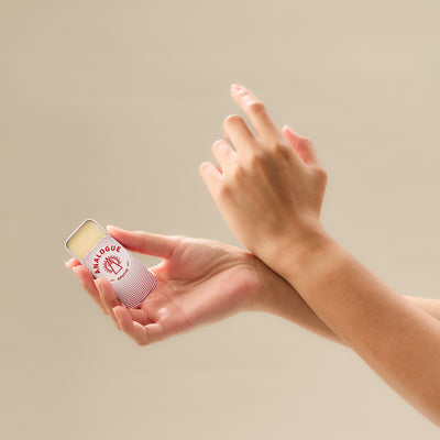 Spraying Oil de Parfum onto the inner wrist