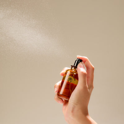 Oil de Parfum bottle held in hand